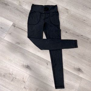 Lululemon High rise leggings with drawstring and pockets.